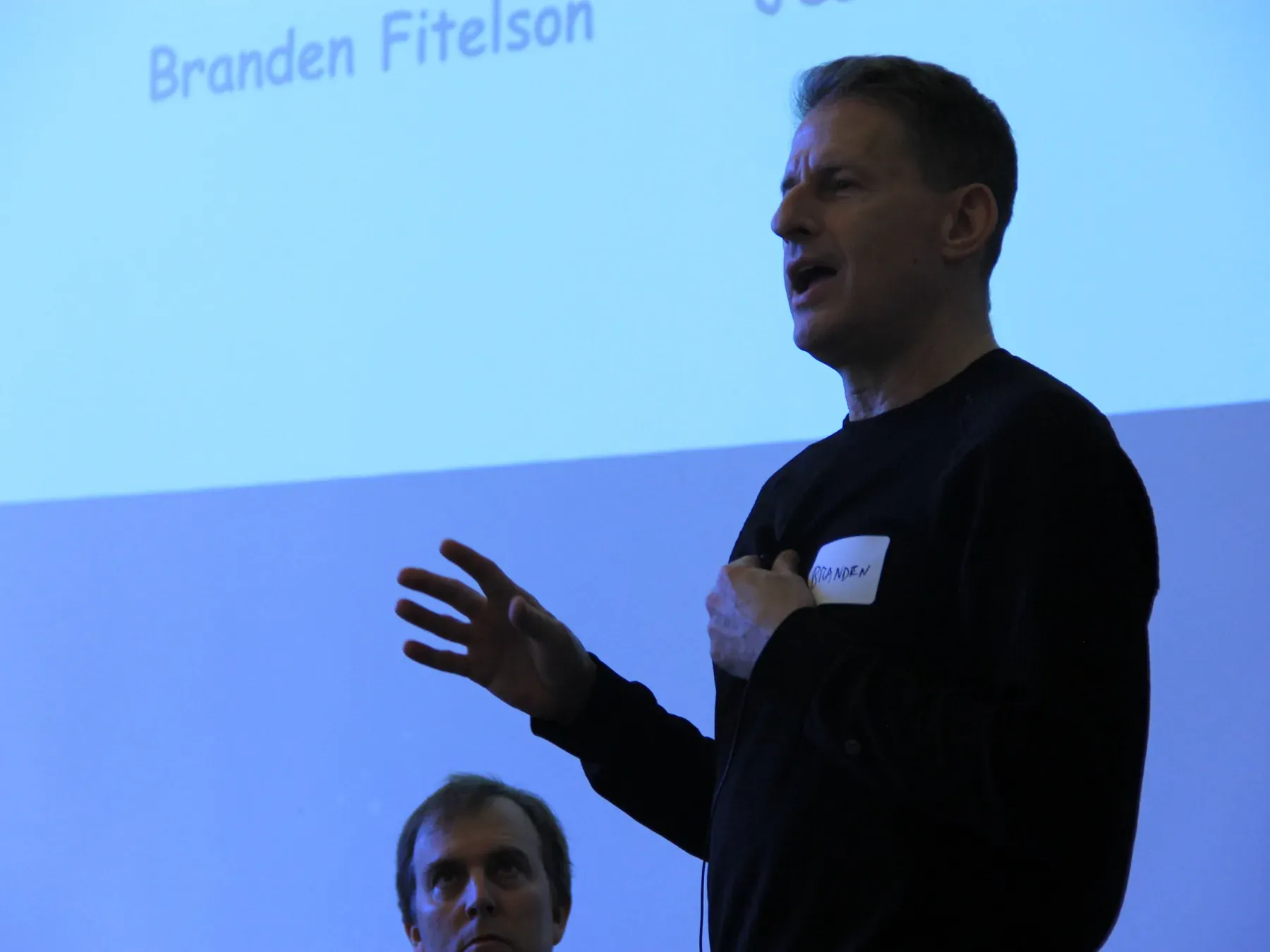 Guest speaker presenting at an AINU event