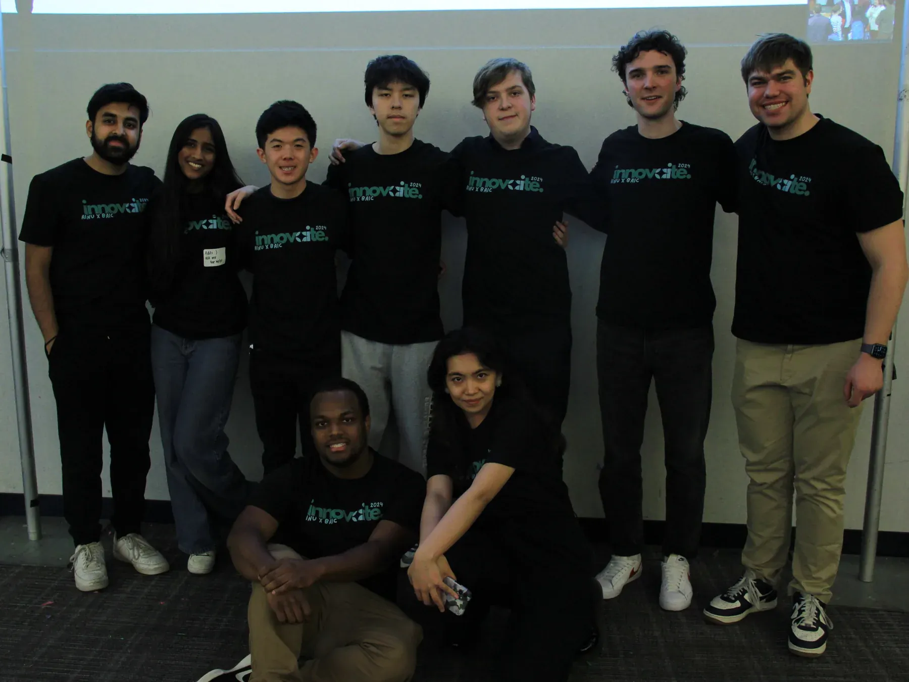 AINU organizing team in matching InnovAIte shirts