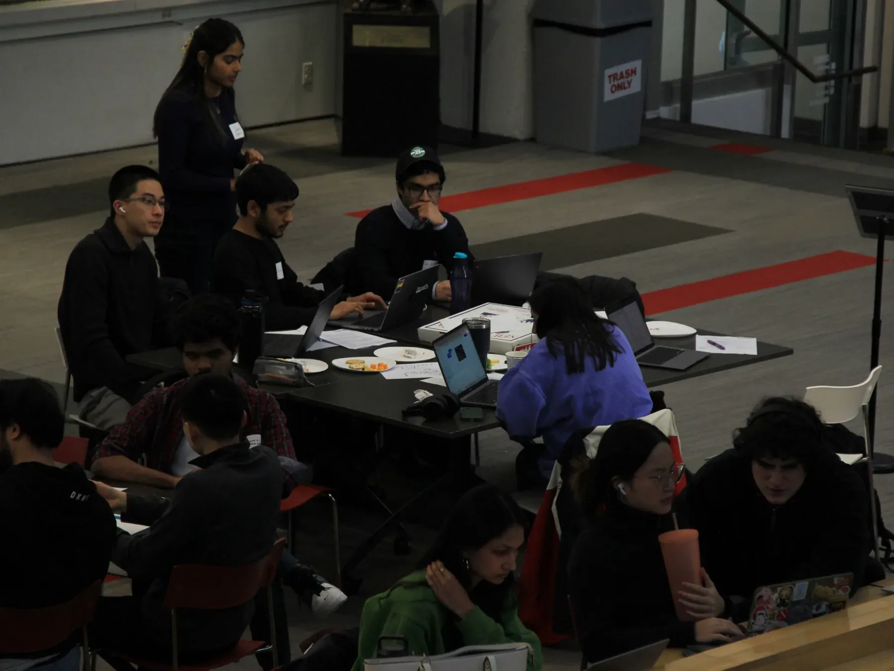 AINU judges and builders discussing a project table